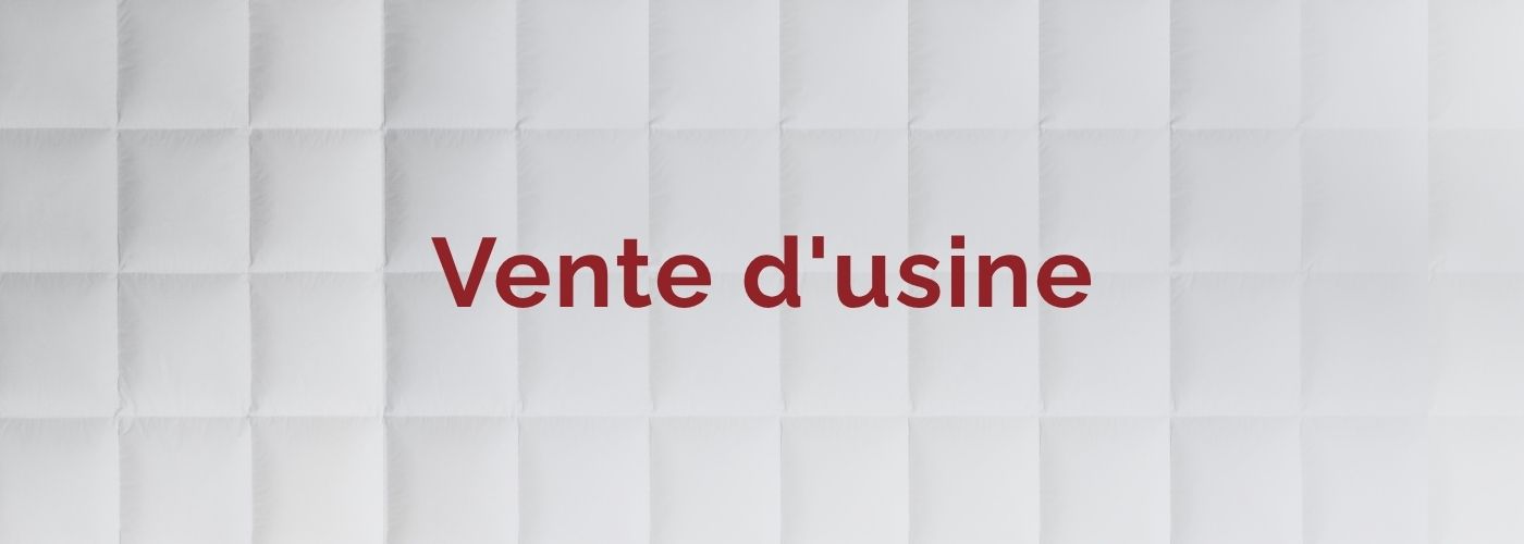 Inscription « Vente d'usine » en lettres majuscules rouges sur fond clair.