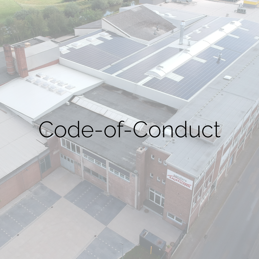 Luftaufnahme von unserem Hauptsitz in Bramsche. Bildaufschrift "Code-of-Conduct".